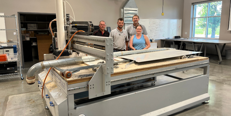 Scheels staff donate a CNC Router to MHS Career Academy