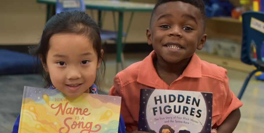 Two students show off their favorite books