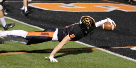 Football player diving into end zone