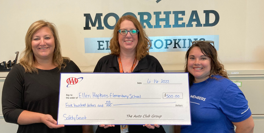 Sarah Martin and AAA officials with grant