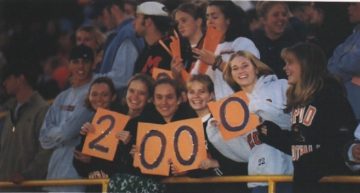 Students holding a sign that reads 2000