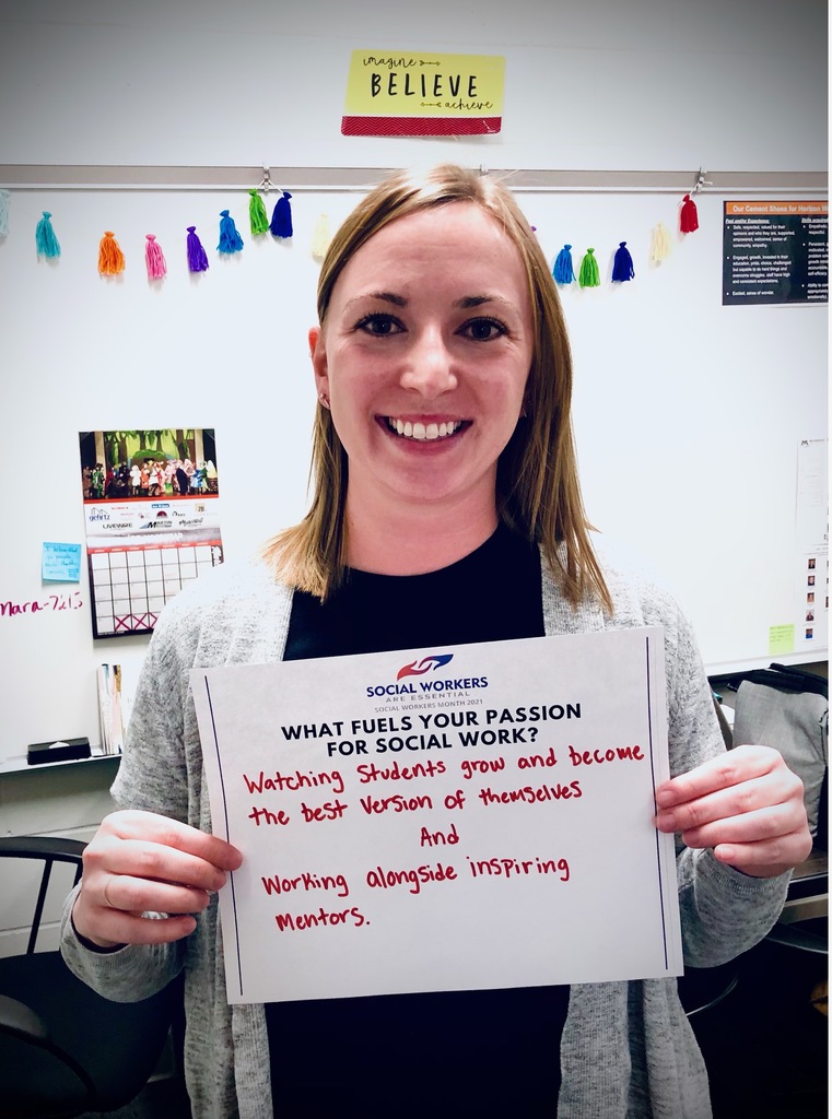Social Worker Holds Sign