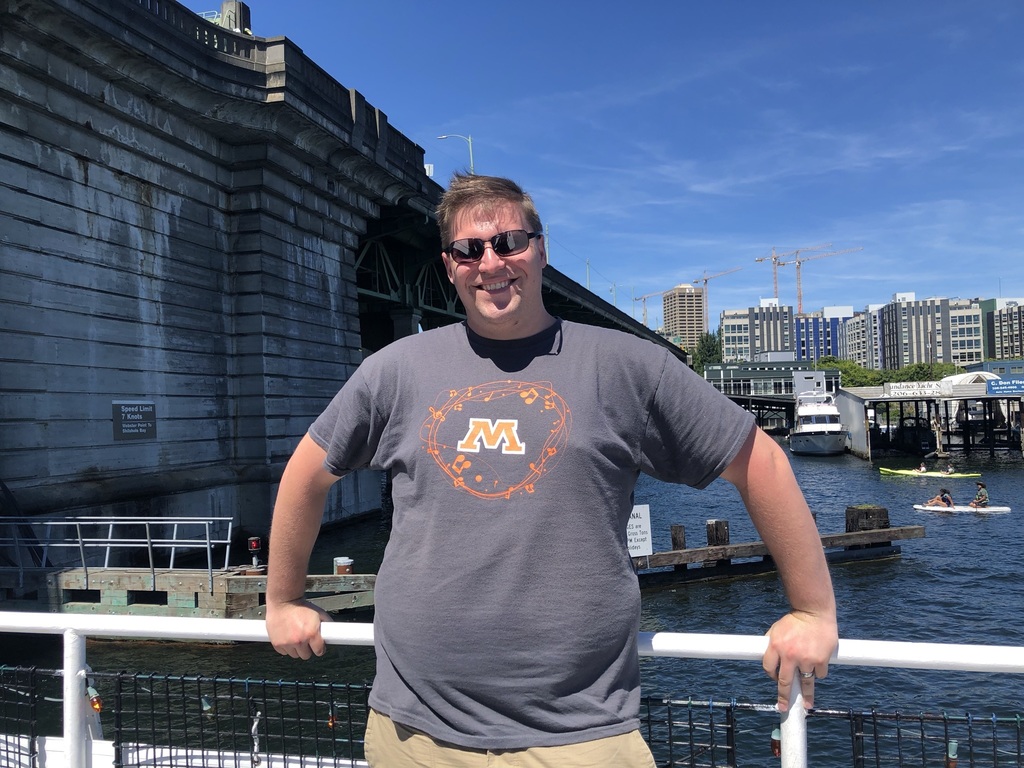 Teacher poses in Spud gear
