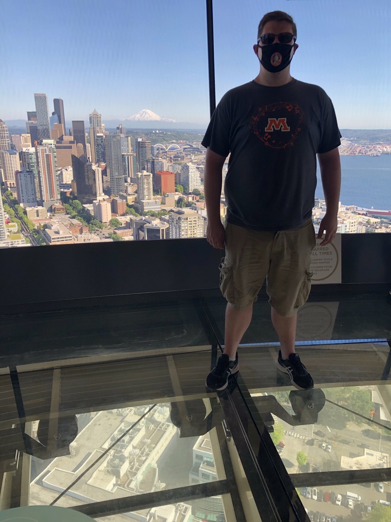 Teacher poses in Spud gear