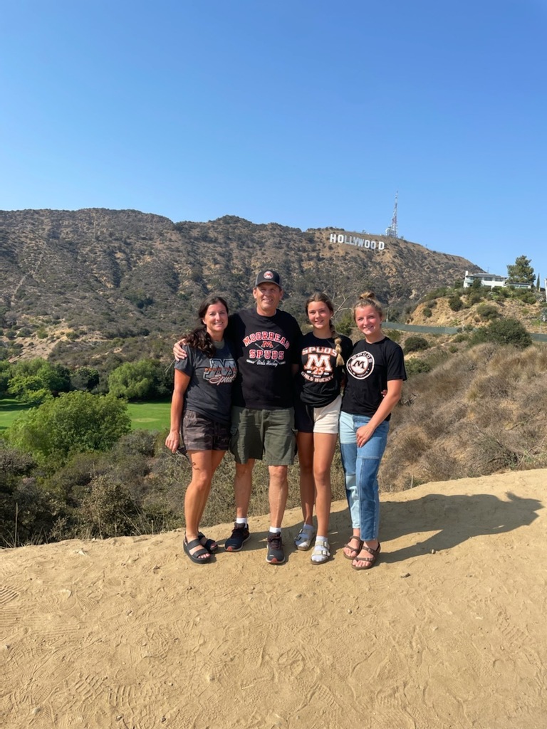 Family poses for picture in Spud gear