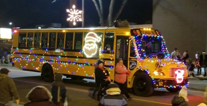 MAPS school bus during the Holiday Lights Parade decorated with holiday lights and decorations