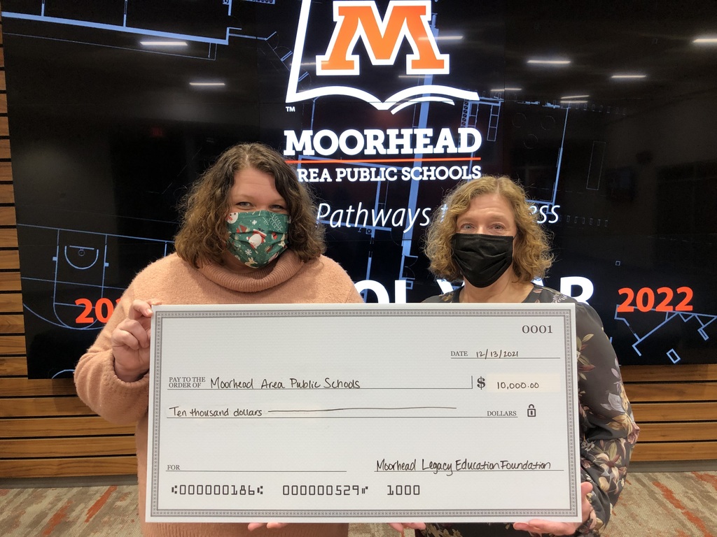 Photo of two individuals holding a check for 10,000 for MAPS