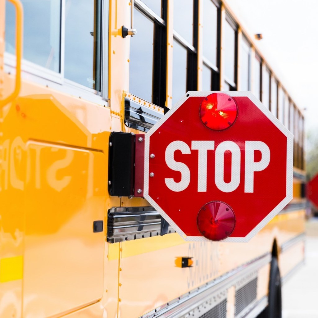 school bus with stop sign out