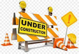 under construction sign with traffic cones