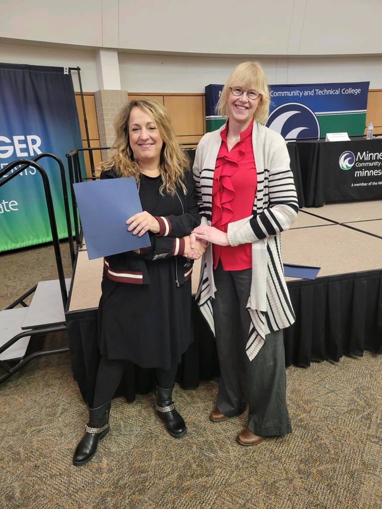 Rebecca with her award and mentor, Roberta Freeman