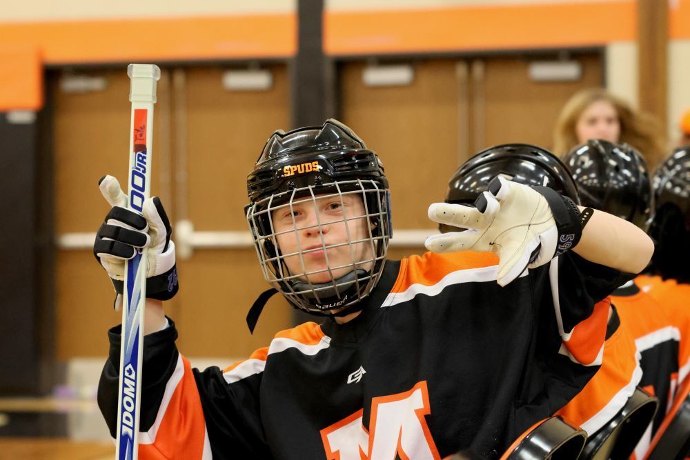 Student poses for the camera during the hockey game