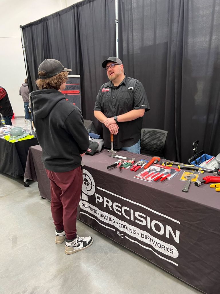 student at precision booth
