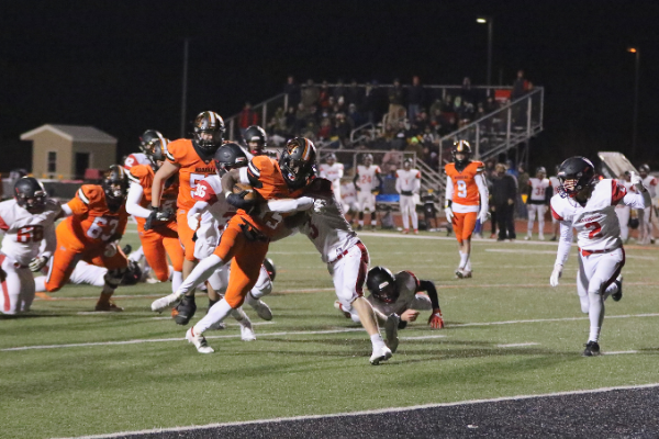 George Nyanforh scores a touchdown for the Spuds. Photo credit: Renee Grover. 