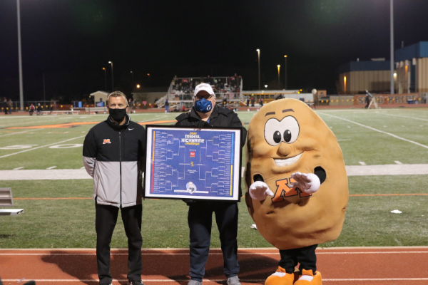 John Millea presents Spuddy with the Mascot Nickname Challenge Award. Pictured: Activities Director Dean Haugo, Minnesota High School League's Media Specialist John Millea and Spuddy. Photo credit: Bill Grover. 