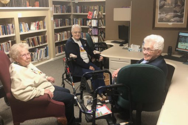 In 2019, Moorhead Volleyball player, Carleigh Vedder's grandma, Ellen, watches SpudsTV with her friends at her retirement home in Fergus Falls.