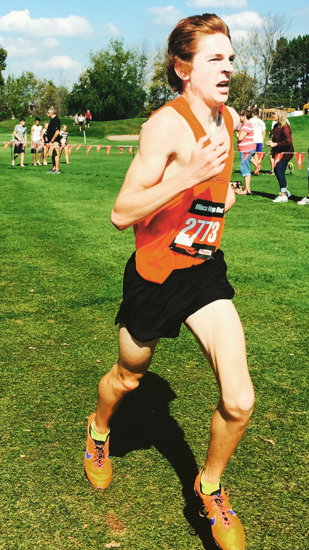 Joe Thibert running cross country.